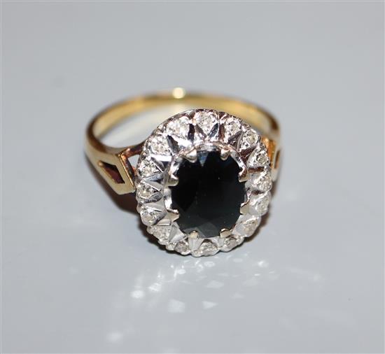 An 18ct, sapphire and diamond cluster ring, size Q.
